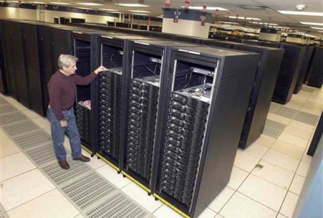 This undated handout photo provided by IBM shows lead engineer Don Grice of IBM inspecting the world's fastest computer, nicknamed "Roadrunner", in the company's Poughkeepsie, N.Y. plant.