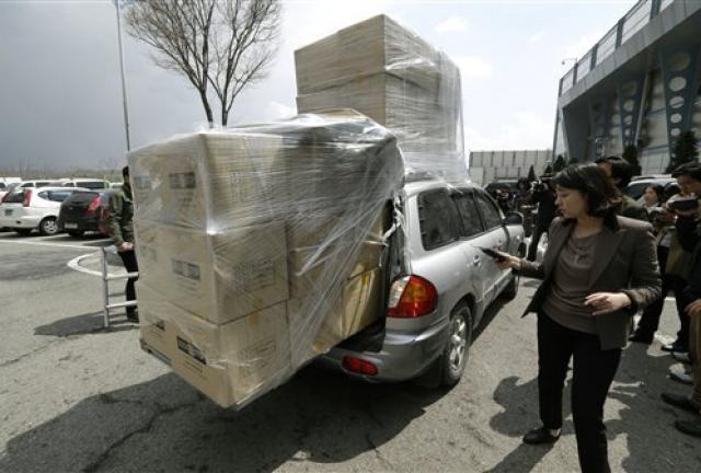 A South Korean vehicle with products from North Korea's Kaesong is surrounded by media upon its arrival at the customs, immigration and quarantine office near the border village of Panmunjom, which has separated the two Koreas since the Korean War, in Paju, north of Seoul, South Korea, Tuesday, April 9, 2013. A South Korean vehicle with products from North Korea's Kaesong is surrounded by media upon its arrival at the customs, immigration and quarantine office near the border village of Panmunjom, which has separated the two Koreas since the Korean War, in Paju, north of Seoul, South Korea, Tuesday, April 9, 2013.