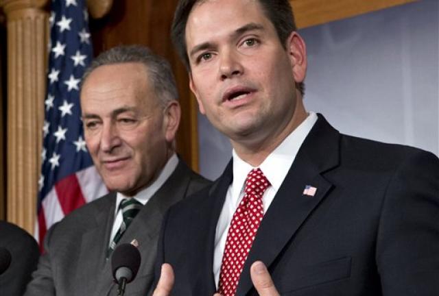 In this Jan. 28, 2013 file photo, Sen. Marco Rubio, R-Fla., right, accompanied by Sen. Charles Schumer, D-N.Y., gestures as he speaks during a bipartisan group of leading senators to announce that they have reached agreement on the principles of sweeping legislation to rewrite the nation's immigration laws, on Capitol Hill in Washington. In this Jan. 28, 2013 file photo, Sen. Marco Rubio, R-Fla., right, accompanied by Sen. Charles Schumer, D-N.Y., gestures as he speaks during a bipartisan group of leading senators to announce that they have reached agreement on the principles of sweeping legislation to rewrite the nation's immigration laws, on Capitol Hill in Washington.