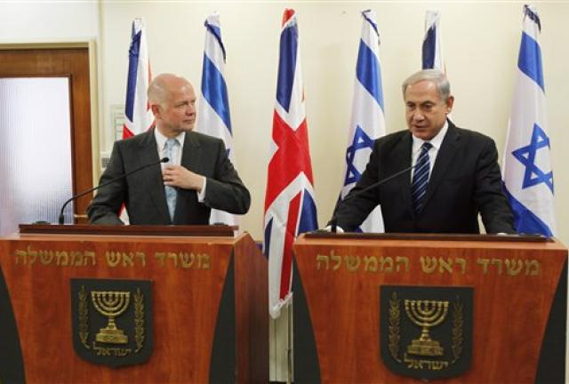 Britain's Foreign Secretary William Hague, left, listens to Israeli Prime Minister Benjamin Netanyahu during a joint news conference before their meeting in Jerusalem, Thursday, May 23, 2013. Britain's Foreign Secretary William Hague, left, listens to Israeli Prime Minister Benjamin Netanyahu during a joint news conference before their meeting in Jerusalem, Thursday, May 23, 2013.