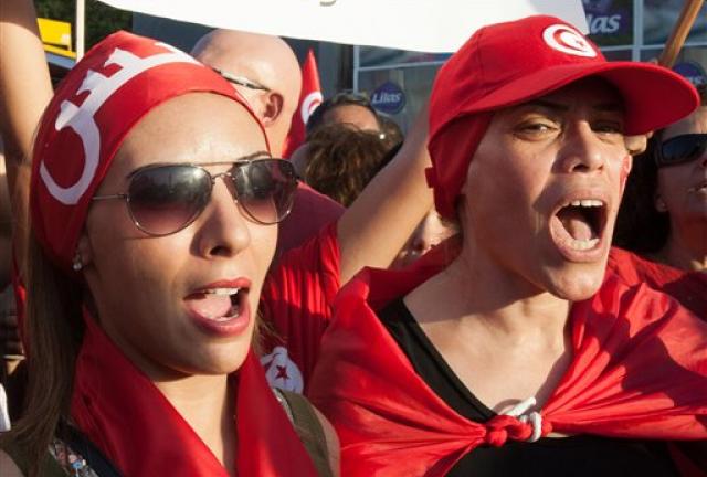 Tunisian women, who oppose the ruling moderate Islamic Ennahda Party, take part in a rally in Tunis, Tunisia, Tuesday, Aug. 13, 2013. Supporters and opponents of Tunisia's Islamist-led government flooded the streets of the capital in rival rallies Tuesday marking national women's day. (AP Photo/Amine Landoulsi) Tunisian women, who oppose the ruling moderate Islamic Ennahda Party, take part in a rally in Tunis, Tunisia, Tuesday, Aug. 13, 2013. Supporters and opponents of Tunisia's Islamist-led government flooded the streets of the capital in rival rallies Tuesday marking national women's day. (AP Photo/Amine Landoulsi)