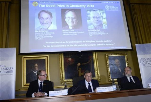 Chairman Sven Lidin, left, permanent secretary Staffan Normark, center, and professor Gunnar Karlstrom of the Royal Swedish Academy of Sciences announce the laureates Martin Karplus, Michael Levitt and Arieh Warshe as winners of the 2013 Nobel Prize in chemistry, during a press conference at the Royal Swedish Academy of Sciences in Stockholm, Sweden, Wednesday Oct. 9, 2013. Chairman Sven Lidin, left, permanent secretary Staffan Normark, center, and professor Gunnar Karlstrom of the Royal Swedish Academy of Sciences announce the laureates Martin Karplus, Michael Levitt and Arieh Warshe as winners of the 2013 Nobel Prize in chemistry, during a press conference at the Royal Swedish Academy of Sciences in Stockholm, Sweden, Wednesday Oct. 9, 2013.