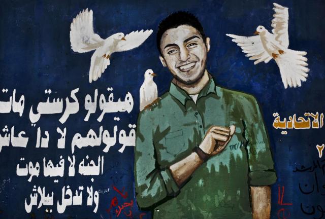 In this Sunday, Nov. 17, 2013 photo, a mural depicting Egyptian activist, Mohammed Hussein, who died during anti-government protests in 2013 is painted on a wall in Tahrir Square, Cairo, Egypt. In this Sunday, Nov. 17, 2013 photo, a mural depicting Egyptian activist, Mohammed Hussein, who died during anti-government protests in 2013 is painted on a wall in Tahrir Square, Cairo, Egypt.