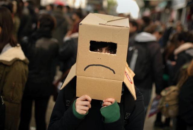 A student wears a cardboard box during a student strike in Madrid, Wednesday, Nov. 20, 2013. A student wears a cardboard box during a student strike in Madrid, Wednesday, Nov. 20, 2013.