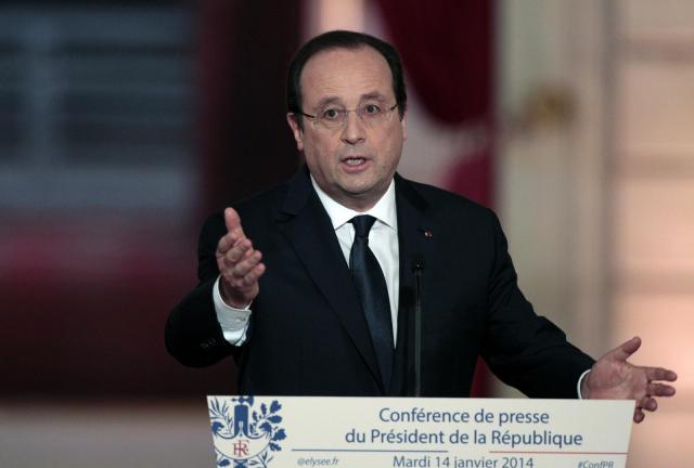 French president Francois Hollande speaks during a press conference to present his 2014 policy plans at the Elysee presidential palace on January 14, 2014, in Paris, France. French president Francois Hollande speaks during a press conference to present his 2014 policy plans at the Elysee presidential palace on January 14, 2014, in Paris, France.