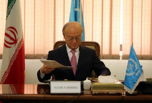 International Atomic Energy Agency (IAEA) Director General Yukiya Amano attends a meeting with the Head of Iran's Atomic Energy Organisation Ali Akbar Salehi (unseen) in Tehran on November 11, 2013.