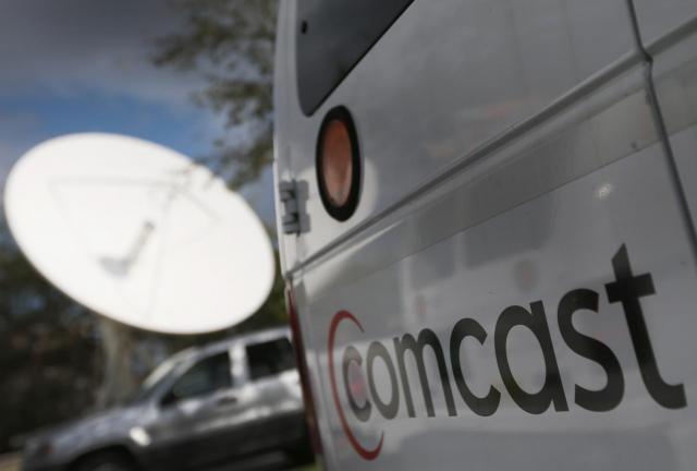 A Comcast truck is seen parked at one of their centers on February 13, 2014 in Pompano Beach, Florida. A Comcast truck is seen parked at one of their centers on February 13, 2014 in Pompano Beach, Florida.