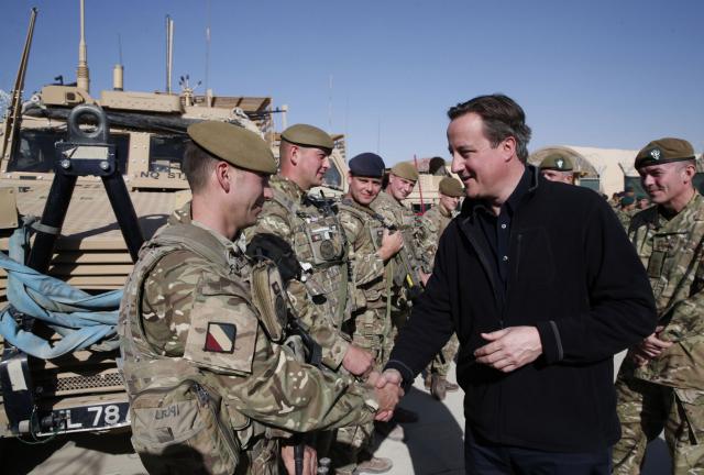 Britain's Prime Minister David Cameron (R) talks to British soldiers during a visit to Camp Bastion on December 16, 2013 near Lashkar Gah, the provincial capital of Helmand province in southern Afghanistan. Britain's Prime Minister David Cameron (R) talks to British soldiers during a visit to Camp Bastion on December 16, 2013 near Lashkar Gah, the provincial capital of Helmand province in southern Afghanistan.