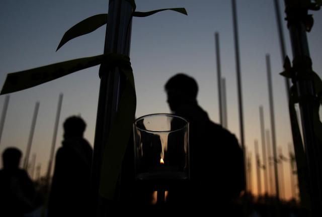 People walk after paying tribute to the victims of the sunken ferry Sewol at a group memorial altar on May 1, 2024 in Seoul, South Korea. 