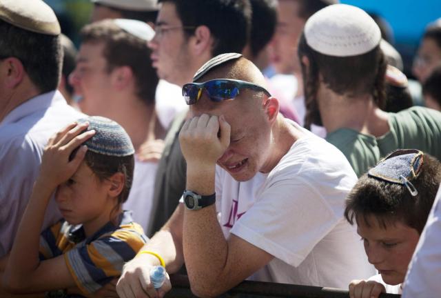 People mourn during the funeral ceremony of Gilad Shaer, 16, at his hometown on July 1, 2014 in Talmon settelment, West Bank. The bodies of Eyal Yifrah, 19, Gilad Shaar, 16, and Naftali Fraenkel, 16, were found on Monday, north of the Palestinian town Halhul, just north of Hebron. They had been missing since June 12. People mourn during the funeral ceremony of Gilad Shaer, 16, at his hometown on July 1, 2014 in Talmon settelment, West Bank. The bodies of Eyal Yifrah, 19, Gilad Shaar, 16, and Naftali Fraenkel, 16, were found on Monday, north of the Palestinian town Halhul, just north of Hebron. They had been missing since June 12.