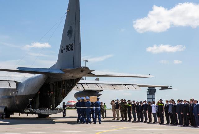 A coffin containing the body of a victim of the crash of Malaysia Airlines flight MH17 is loaded onto a plane for transport to the Netherlands during a departure ceremony on July 23, 2014 in Kharkiv, Ukraine. A coffin containing the body of a victim of the crash of Malaysia Airlines flight MH17 is loaded onto a plane for transport to the Netherlands during a departure ceremony on July 23, 2014 in Kharkiv, Ukraine.