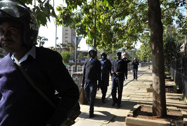 Kenya policemen patrol near the parliamnet during the debate on the controversial new security legislation that would crack down on terror suspects and curtail December 18, 2024 journalists' freedoms if they're deemed to 'undermine' investigations. 