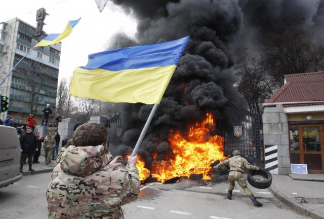 Volunteer soldiers' battalion 'Aydar' and their supporters burn tires blocking the roadway in front of the Ministry of Defense, during a protest in Kiev, Ukraine on February 2, 2015. Soldiers protest against the disbandment of their battalion. Volunteer soldiers' battalion 'Aydar' and their supporters burn tires blocking the roadway in front of the Ministry of Defense, during a protest in Kiev, Ukraine on February 2, 2015. Soldiers protest against the disbandment of their battalion.