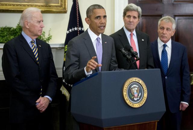 U.S. President Barack Obama, second from left, delivers a statement on legislation he sent to Congress to authorize the use of military force (AUMF) against the Islamic State with U.S. Vice President Joseph 'Joe' Biden, from left, Obama, John Kerry, U.S. secretary of state, and Chuck Hagel, outgoing U.S. secretary of defense, in the Roosevelt Room of the White House in Washington, D.C., U.S., on Wednesday, Feb. 11, 2015. U.S. President Barack Obama, second from left, delivers a statement on legislation he sent to Congress to authorize the use of military force (AUMF) against the Islamic State with U.S. Vice President Joseph 'Joe' Biden, from left, Obama, John Kerry, U.S. secretary of state, and Chuck Hagel, outgoing U.S. secretary of defense, in the Roosevelt Room of the White House in Washington, D.C., U.S., on Wednesday, Feb. 11, 2015.