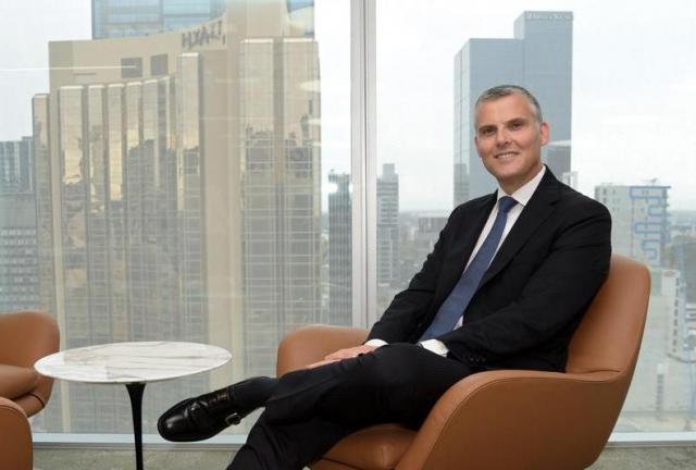 Brendan Harris, chief financial officer-elect of South32 Ltd., poses for a photograph in Melbourne, Australia, on Tuesday, March 17, 2015. South32, the mining company that BHP Billiton Ltd. plans to spin off, will pay 40 percent of its underlying earnings as dividends and will cost the worlds biggest miner $738 million in one-time charges.