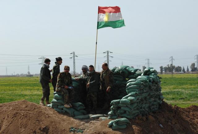 Iraqi Kurdish forces stand in sandbagged post as they push the frontline forward against ISIS forces in the Tal al-Ward district 20 miles southwest of Kirkuk, Iraq, on March 13, 2015.
