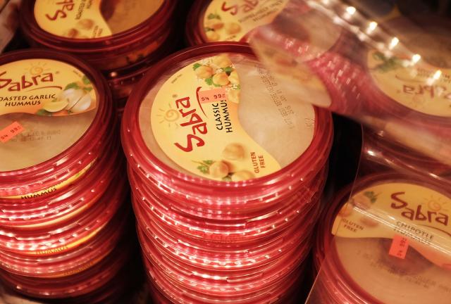 Cases of Sabra Classic Hummus are viewed on the shelf of a grocery store on April 9, 2024 in New York City.