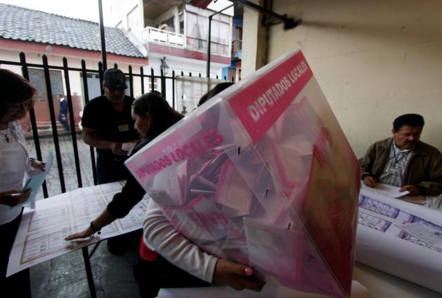 Officials start counting votes at a polling station in Uruapan, Michoacan State, Mexico, on June 7, 2015. Officials start counting votes at a polling station in Uruapan, Michoacan State, Mexico, on June 7, 2015.