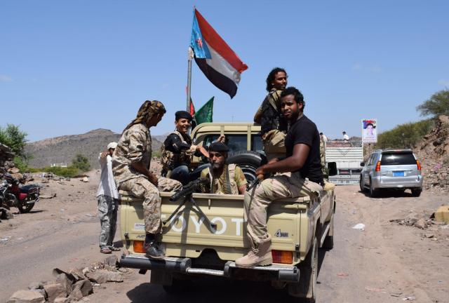 Yemeni fighters loyal to Yemen's exiled President Abedrabbo Mansour Hadi sit on a pick-up truck, flying the separatist Southern Movement flag, on August 22, 2024 near the city of Daleh, 280 kilometres south of the capital Sanaa. Yemeni fighters loyal to Yemen's exiled President Abedrabbo Mansour Hadi sit on a pick-up truck, flying the separatist Southern Movement flag, on August 22, 2024 near the city of Daleh, 280 kilometres south of the capital Sanaa.