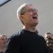 Apple CEO Tim Cook smiles as he visits an Apple Store in Palo Alto, California, April 10, 2015. Stephen Lam/Getty Images