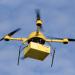 A quadcopter delivering a package. Getty Images