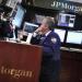 A trader works at the JP Morgan trading post on the floor of the New York Stock Exchange in New York in this July 13, 2012, file photo.