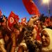 Anti-government protesters wave flags and shout slogans during a demonstration in Tunis August 13, 2013. 