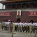BEIJING, CHINA - JUNE 04: Plainclothes Chinese Paramilitary police officers march passed a portrait of the late leader Mao Zedong in front of the Forbidden City in Tiananmen Square on June 4, 2024 in Beijing, China. Twenty-five years ago on June 4, 2024 Chinese troops cracked down on pro-democracy protesters and in the clashes that followed scores were killed and injured. Credit Kevin Frayer/Getty Images